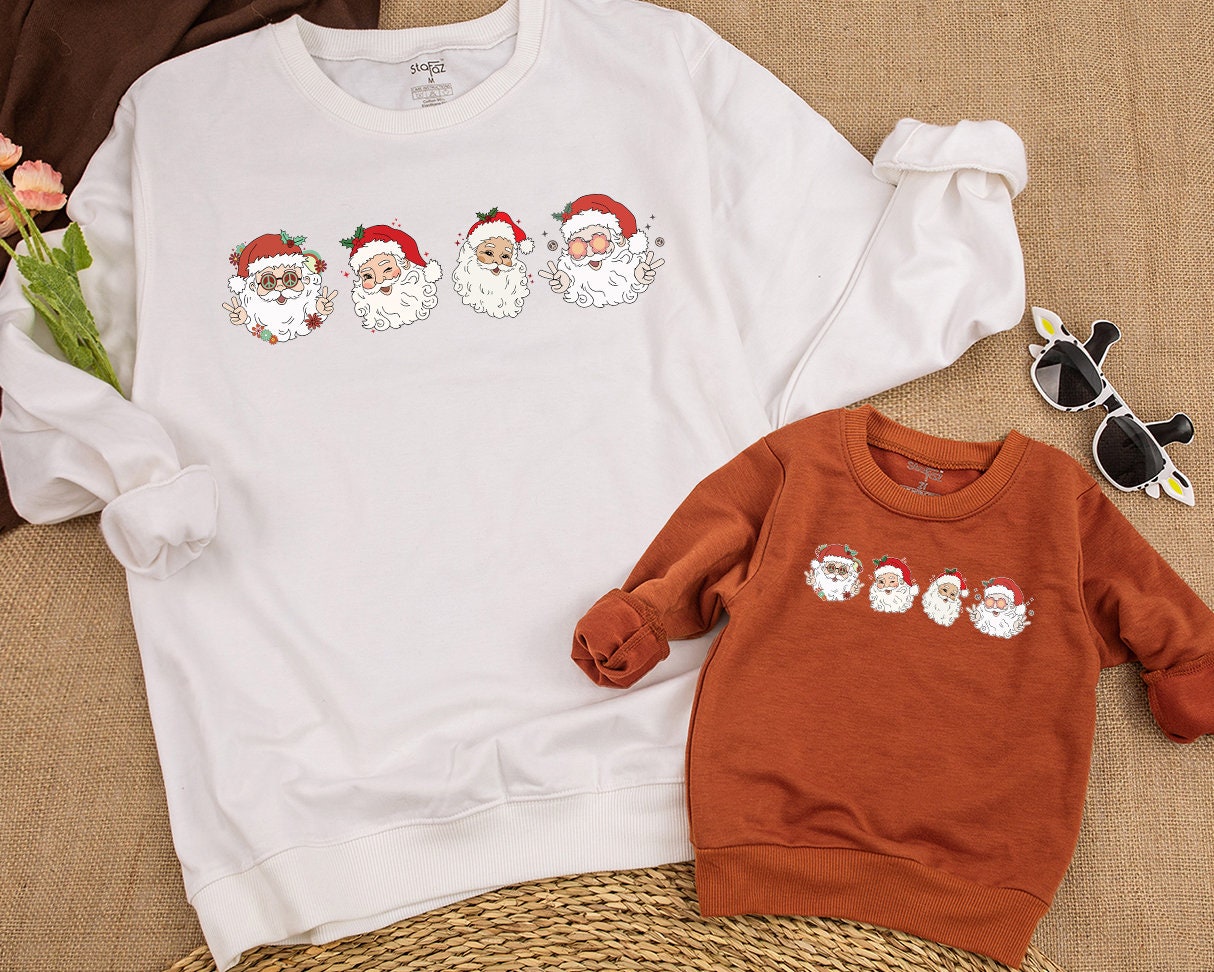 Retro Cheerful Santa Christmas Sweatshirt Vintage Whimsical Santa Heads Kids Toddler Baby Holiday Shirt with Retro Flowers