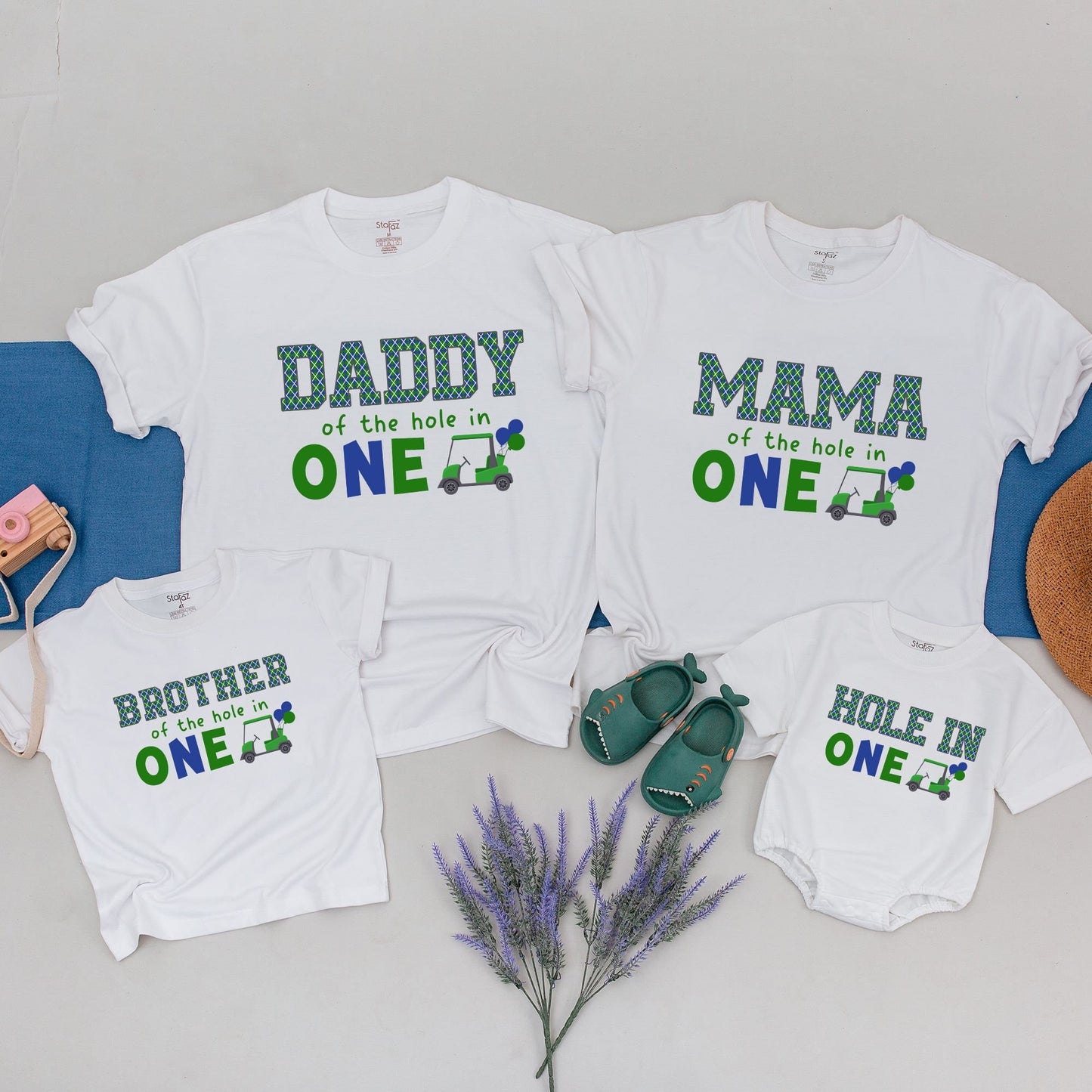 Hole in One First Birthday Matching Family Golf Theme Party Shirt Outfit with Daddy Mama Brother Plaid Green Blue Design and playful Golf Cart Blue Balloons perfect for an unforgettable celebration.