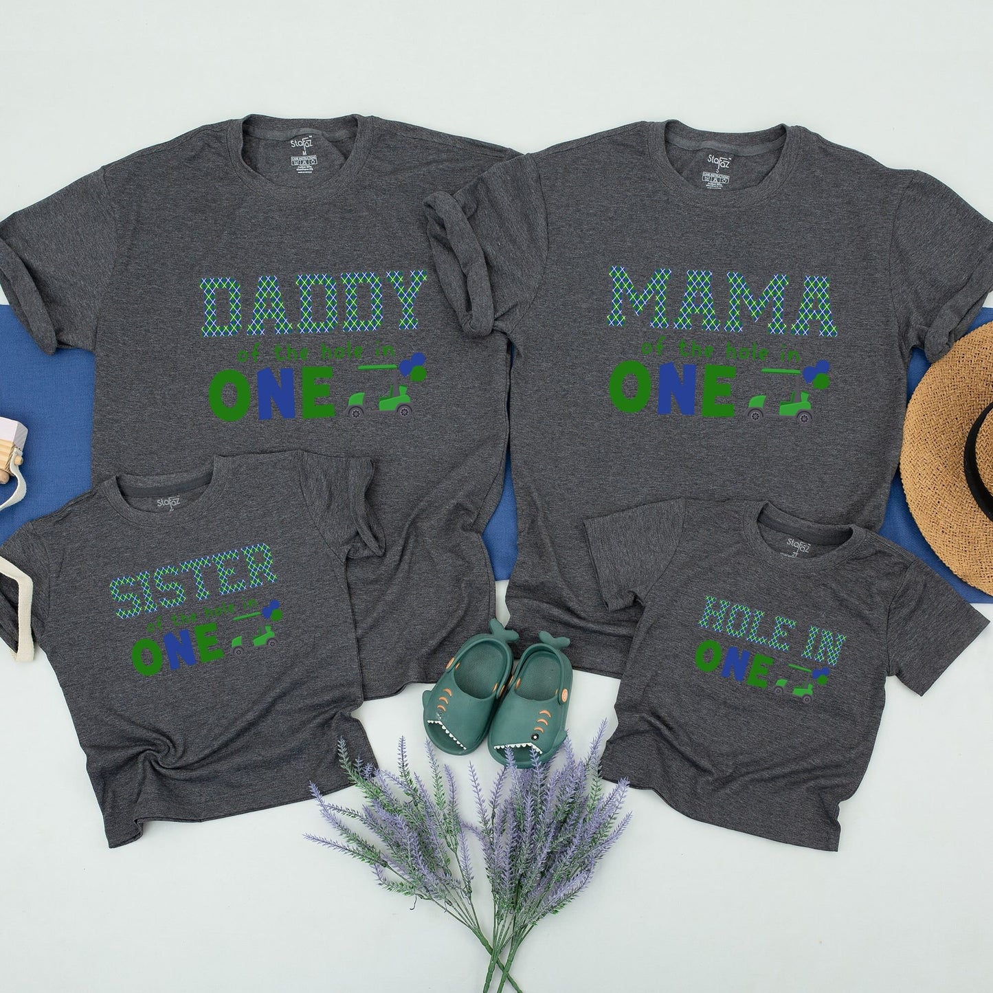 Hole in One First Birthday Matching Family Golf Theme Party Shirt Outfit with Daddy Mama Brother Plaid Green Blue Design and playful Golf Cart Blue Balloons perfect for an unforgettable celebration.