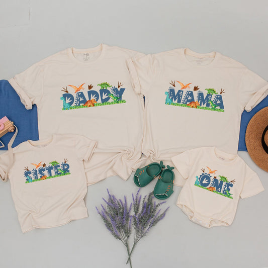 Matching Family Dinosaur Birthday Tees MamaSaurus DadaSaurus Kids 1st Birthday Party Outfit Whimsical Cartoon Dino Design Navy Text