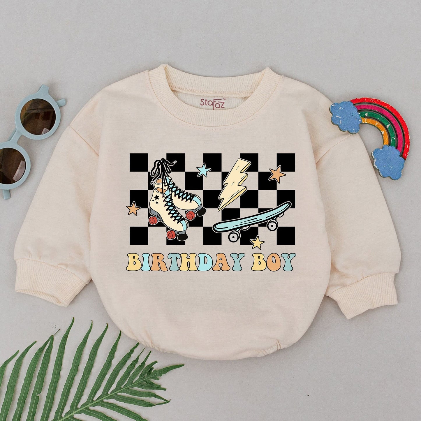 Playful Birthday Boy Bubble Romper First 1st Birthday Baby Boy Outfit featuring retro checkerboard, skateboard, roller skate, lightning, and star graphics