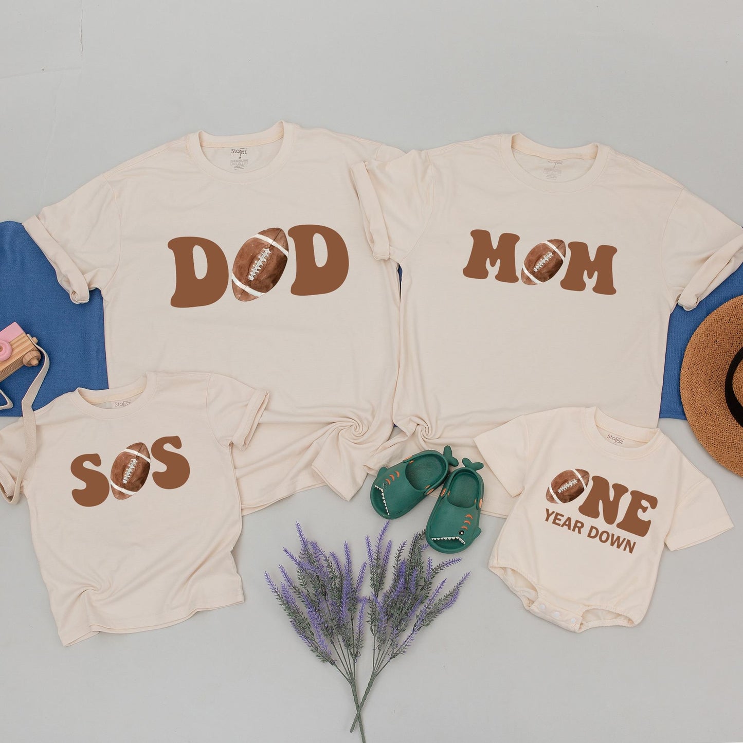 One Year Down Football First Birthday Matching Family Shirts with Brown Block Lettering Realistic Sports Game Day Theme Party Outfits