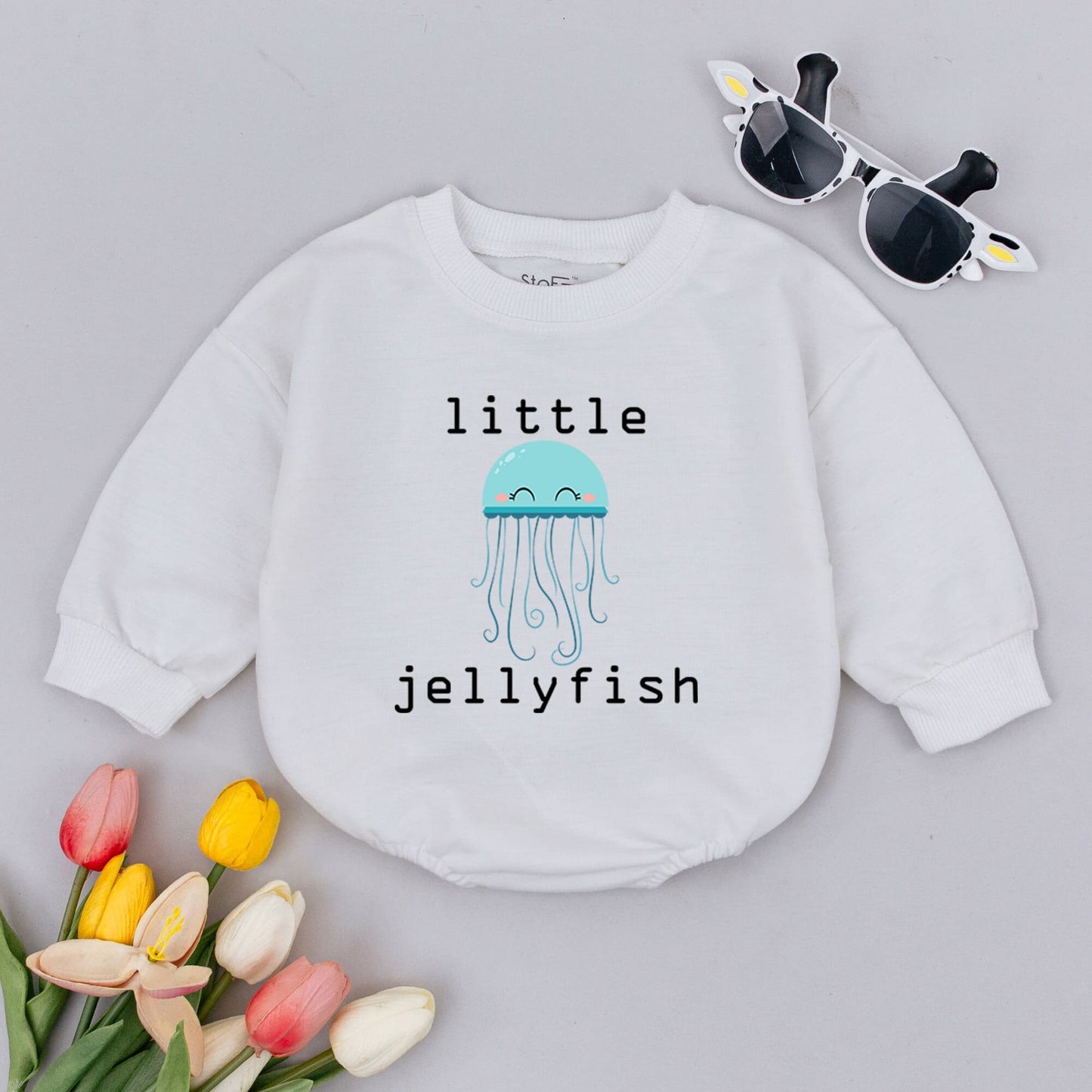 Little Jellyfish Baby Romper Unisex Minimalist Gender Neutral Infant Outfit featuring a cute light blue smiling jellyfish design perfect for baby showers.