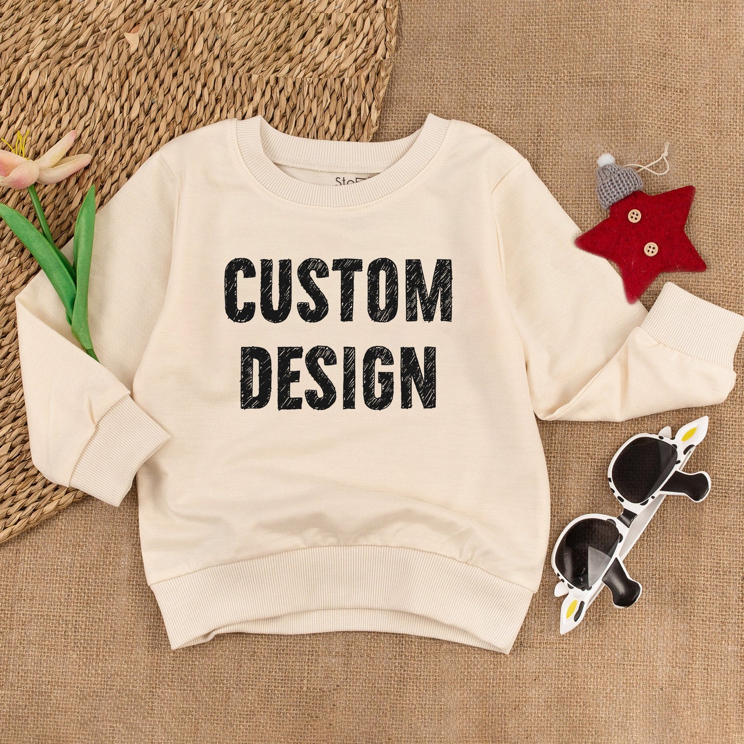 Custom Kids Sweatshirt featuring bold black 'CUSTOM DESIGN' text, a modern comfortable toddler boy girl top perfect for Christmas holiday or baby shower gift