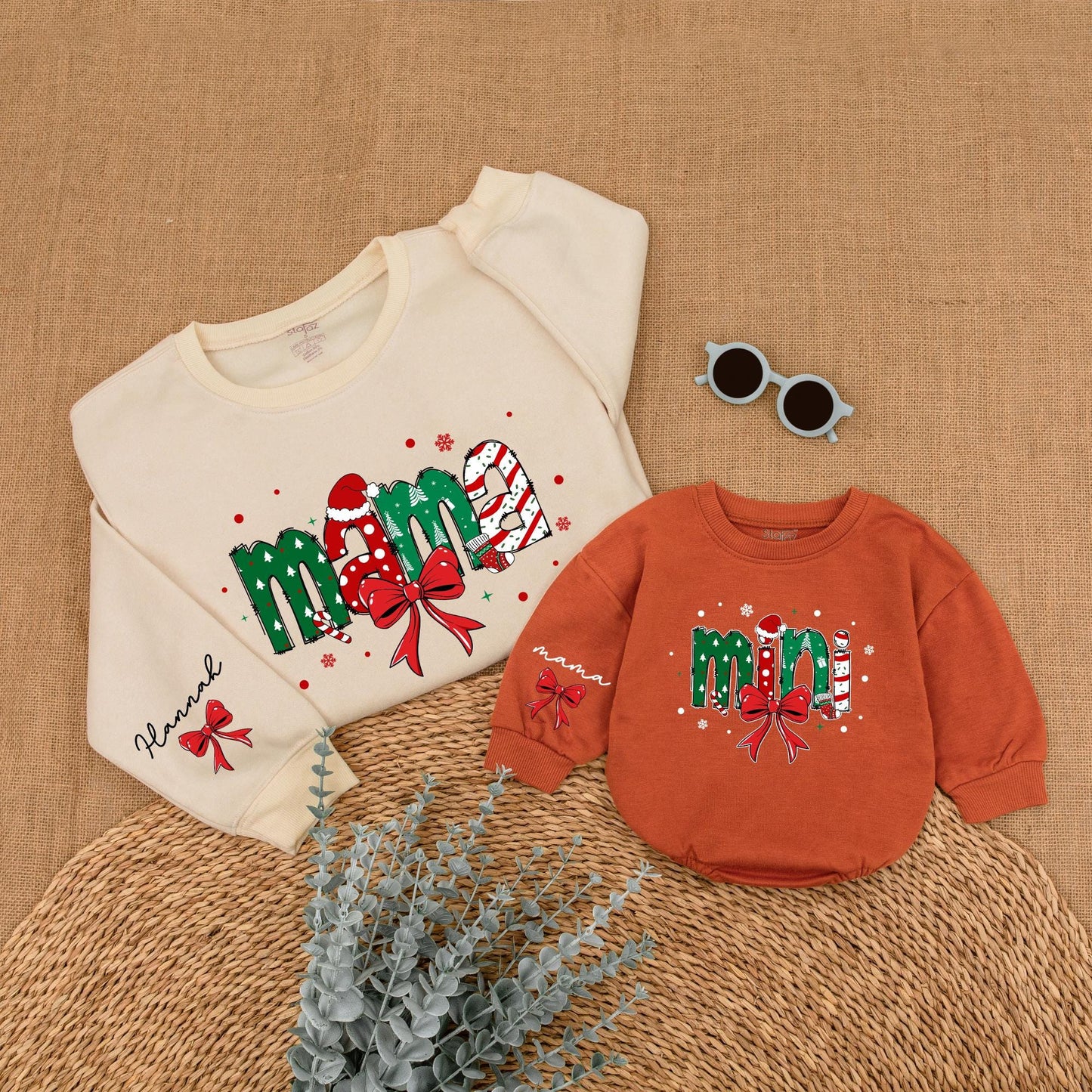 Personalized Christmas Mama Mini Matching Sweatshirt and Baby Romper featuring festive joyful candy cane Santa hat Christmas tree designs and red bows