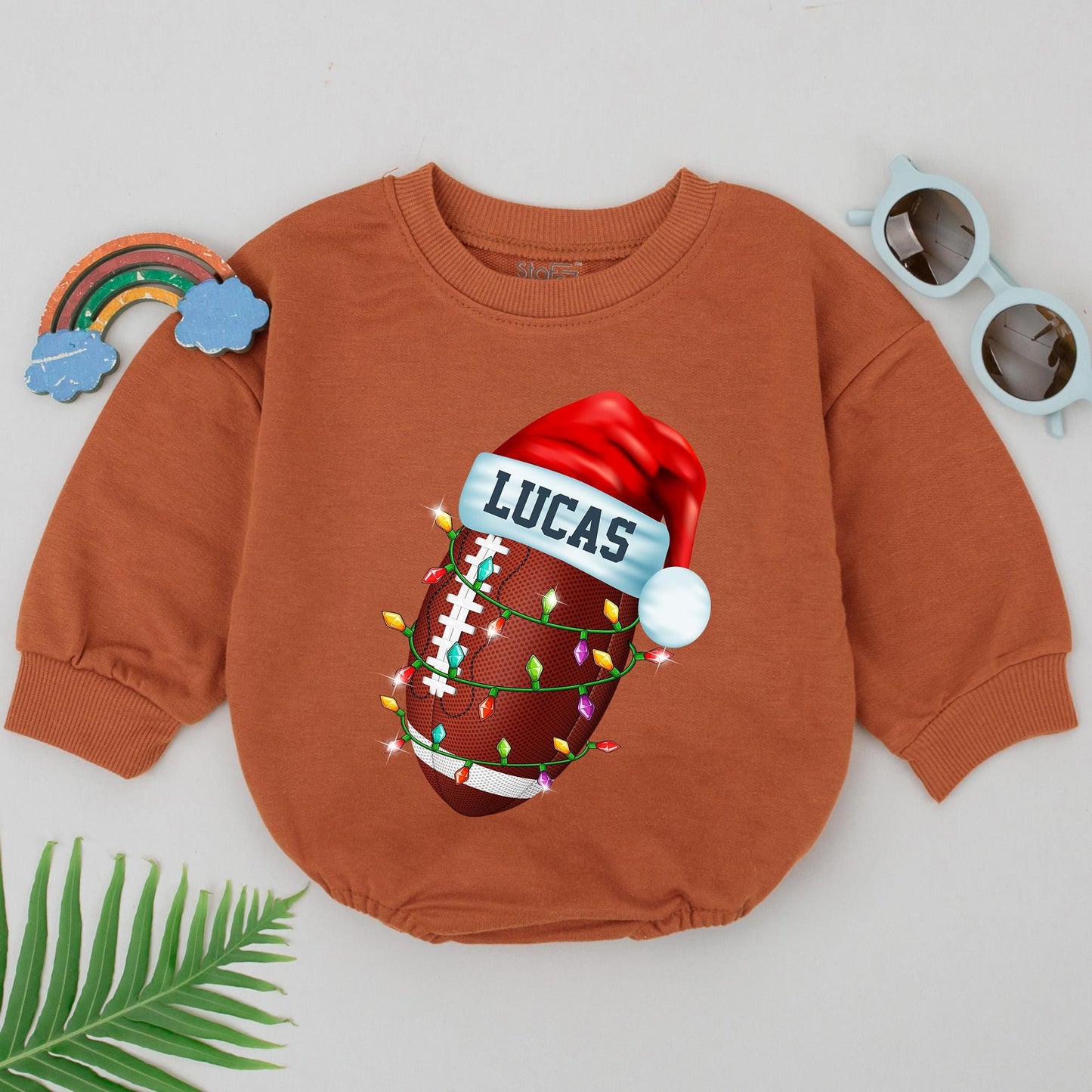 Personalized Baby Boy Football Christmas Romper, First Birthday Outfit with Festive Santa Hat and String Lights Design