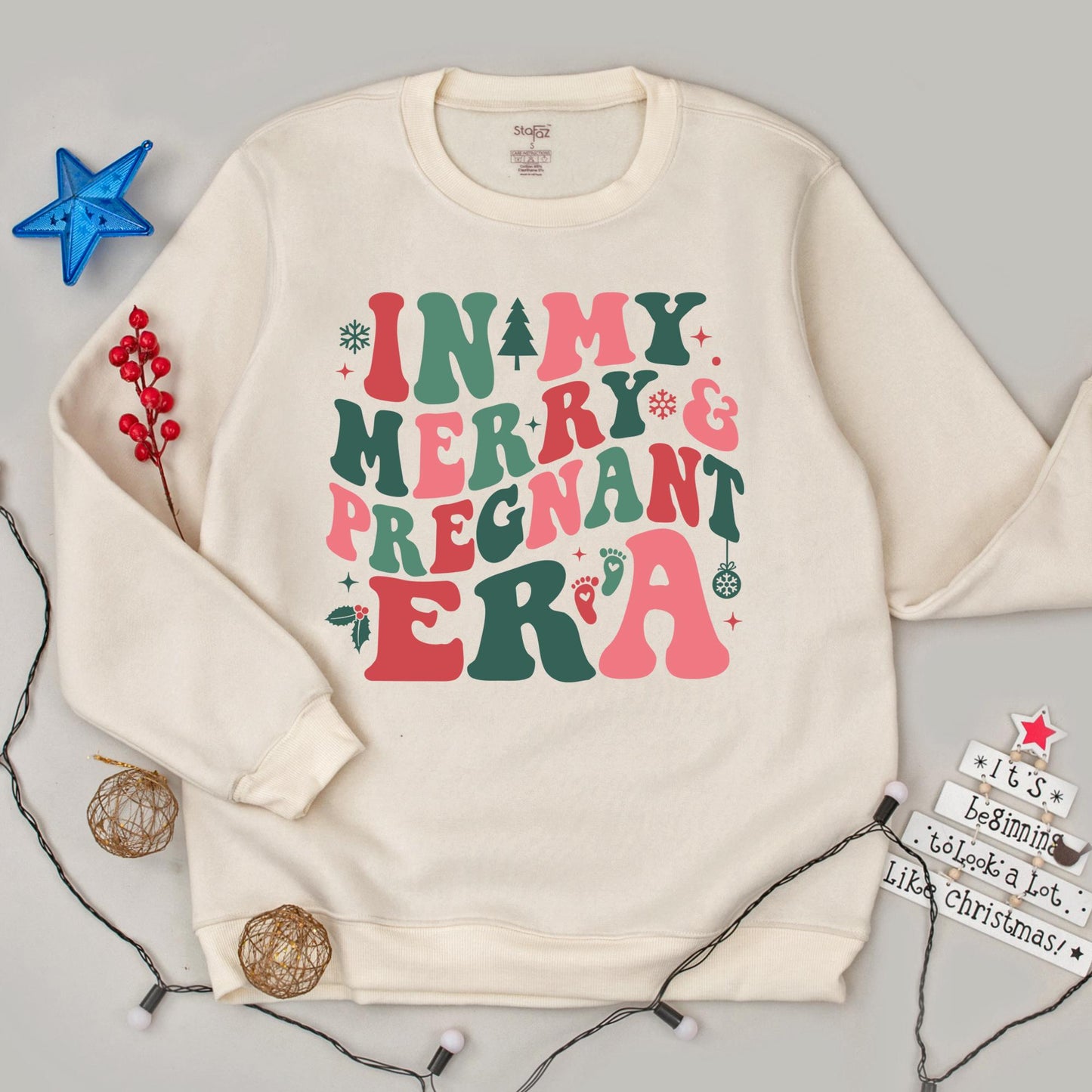 In my Merry & Pregnant Era Christmas Sweatshirt, Groovy Font Holiday Pregnancy Reveal, Xmas Gift for Mom, Red Green Pink Snowflakes