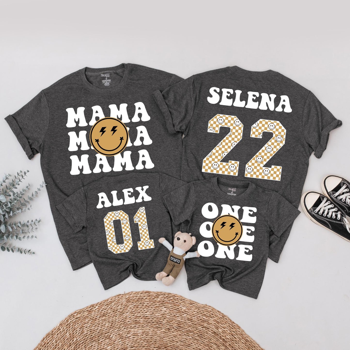Matching One Happy Dude 1st Birthday Family Shirt Set: Retro Smiley Face Design with Black Fonts, Gold Checkerboard Numbers & Lightning Bolt Eyes (138 chars)