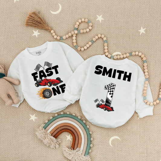 Fast One Racecar Birthday Romper Baby Boy First Birthday Bodysuit Cute Toddler 1st Birthday Outfit with Checkered Flags and Red Car Design