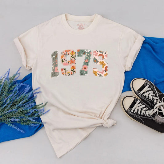 Retro 1975 Birthday Floral Shirt: Custom Year Flower Power Tee for Women, Vintage Style 50th Birthday Gift, Personalized Outfit, Comfortable Cotton (139 chars)