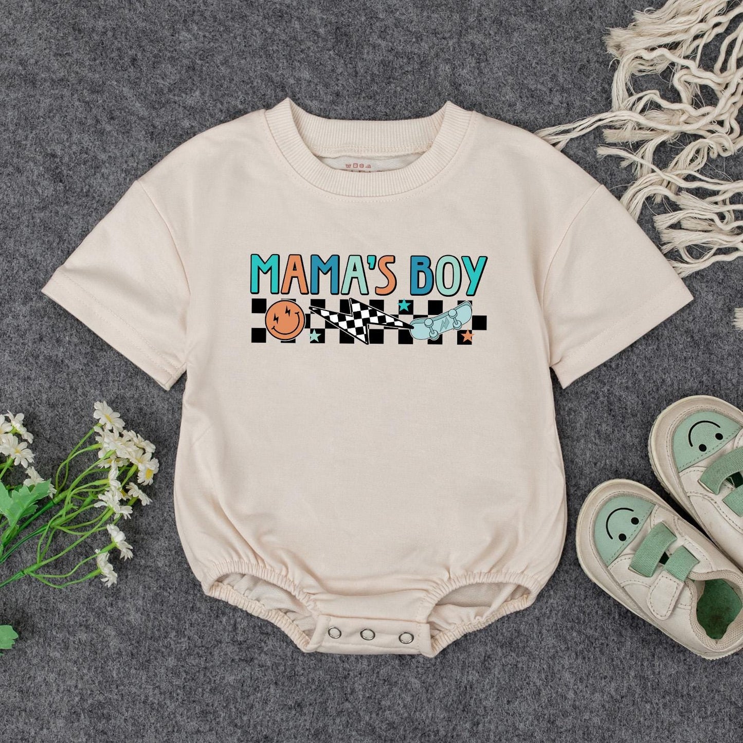 Retro Mama's Boy Romper: Groovy Checkered Bodysuit for Baby Boy, Fun Smiley Face Skateboard Outfit, Soft Cotton Clothes Gift Idea (138 chars)