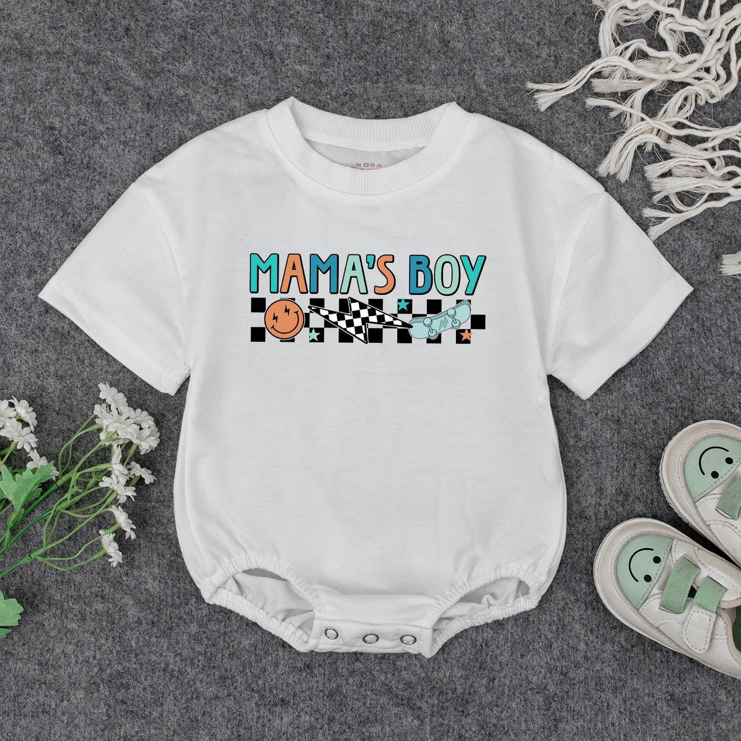 Retro Mama's Boy Romper: Groovy Checkered Bodysuit for Baby Boy, Fun Smiley Face Skateboard Outfit, Soft Cotton Clothes Gift Idea (138 chars)