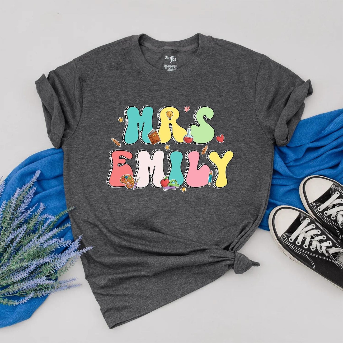 Personalized Teacher Shirt Mrs. Emily Rainbow Name Back to School Outfit, Custom Colorful Letters, Cute Heart Apple Beaker Book Pencil Graphic Gift for Women (138)