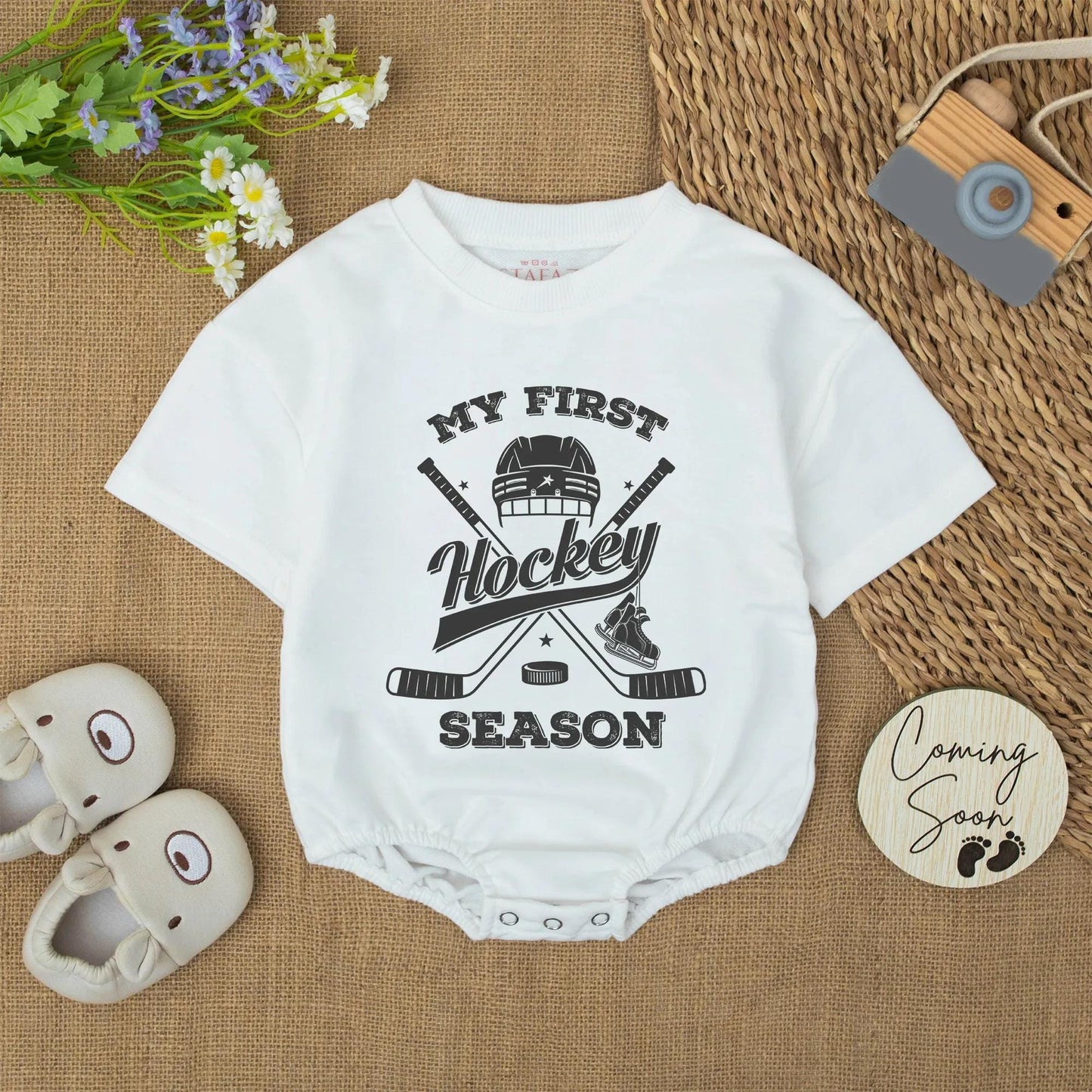My First Hockey Season Baby Bodysuit: Vintage-Style Newborn Outfit with Helmet, Sticks & Skates Graphic, Cute Winter Romper, Unique Hockey Baby Shower Gift (137 chars)