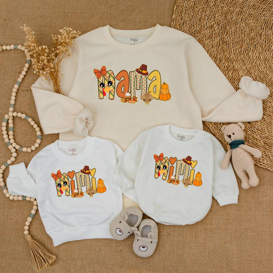 Adorable Mama and Mini Fall Sweatshirts with Playful Pumpkin Turkey Designs Warm Orange Red Colors Perfect for Thanksgiving Family Outings