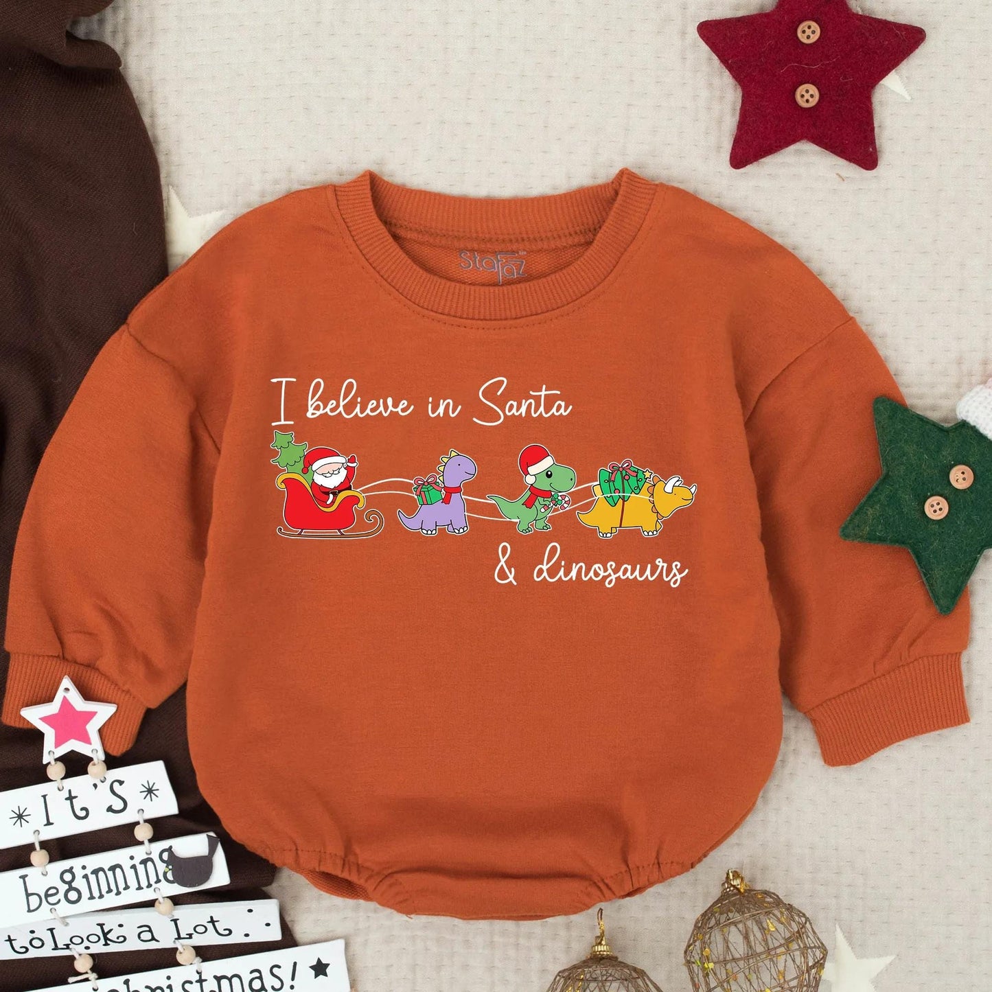 Santa Dinosaur Christmas Romper: I Believe! Funny Toddler Holiday Sweatshirt, Colorful Cartoon Santa Sleigh with Purple, Green & Yellow Dinos Gift Idea (138 chars)