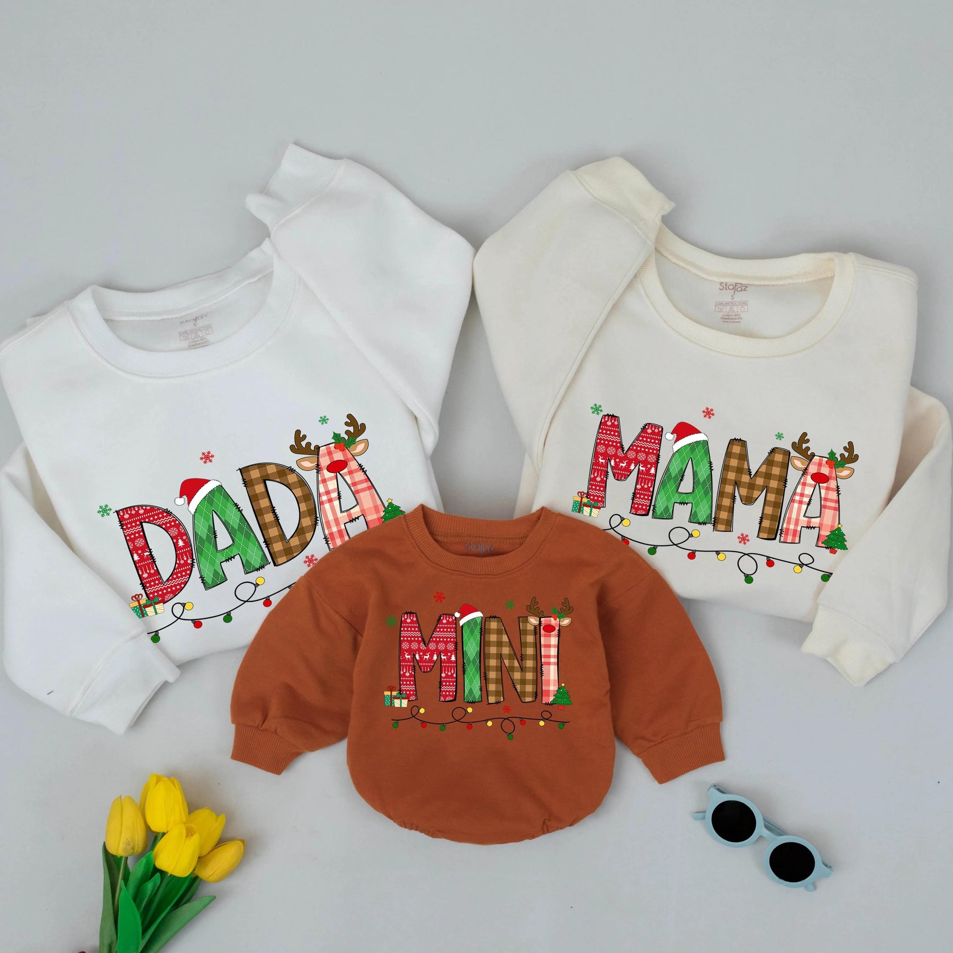 Festive Christmas Mama Mini Matching Family Sweatshirt with Playful Patterned Letters Santa Hats Reindeer Antlers Presents Trees Holiday Celebration