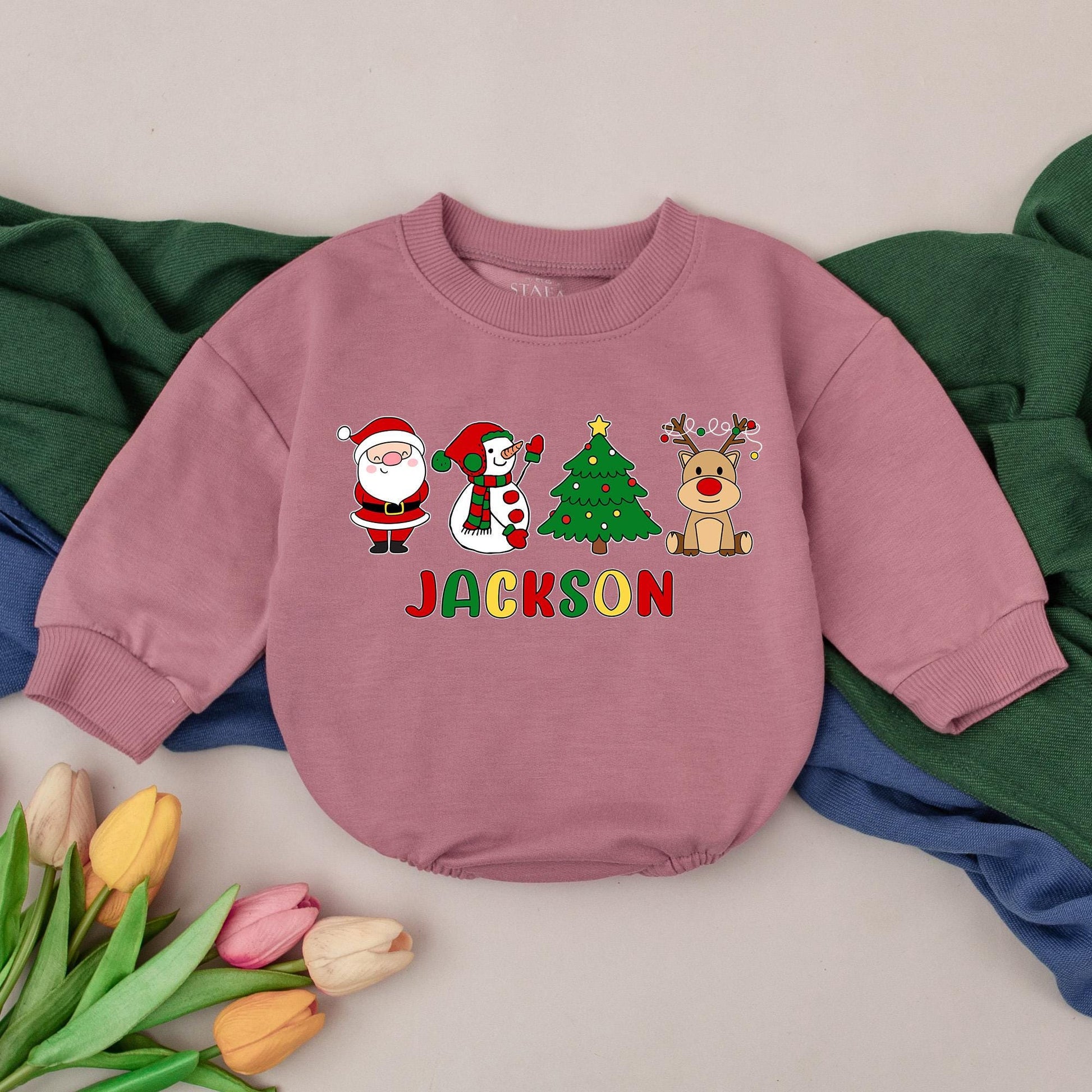 Jackson's First Christmas Bubble Romper Baby Boy Girl with Santa Snowman Tree Reindeer Design Red Green Yellow Colors Joyful Childlike Style
