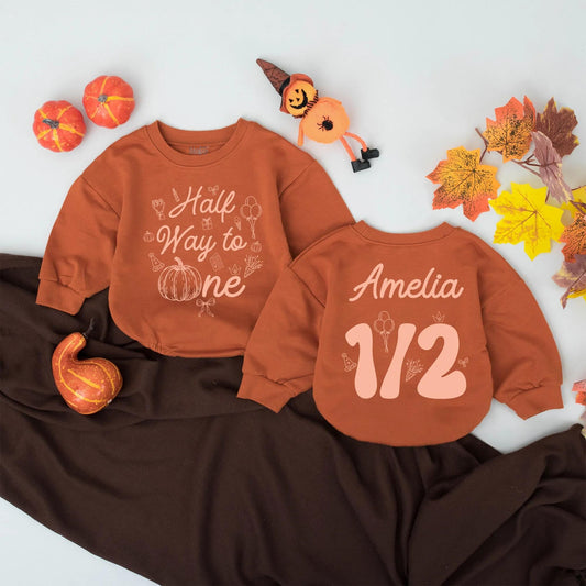 Personalized Half Way to One Pumpkin Bubble Romper with warm orange fall graphics festive half birthday celebration outfit for baby girl boy