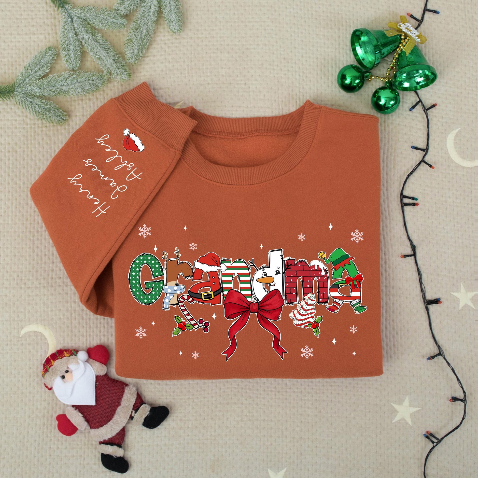 Custom Christmas Grandma Sweater with Grandkids Names on Sleeve Festive Santa Hat Snowman Candy Cane Design Gift for Nana