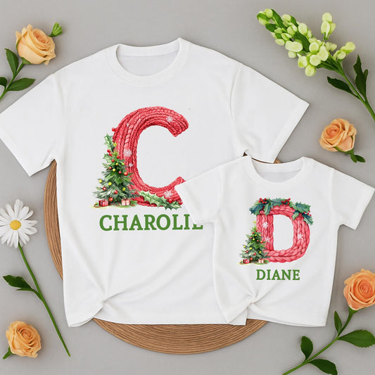 Personalized Family Christmas Shirt Initial & Name Festive Holiday Tee Knitted Red Letter Snowflakes Holly Berries Tree Gift Boxes Green Text