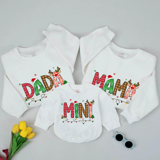 Festive Christmas Mama Mini Matching Family Sweatshirt with Playful Patterned Letters Santa Hats Reindeer Antlers Presents Trees Holiday Celebration