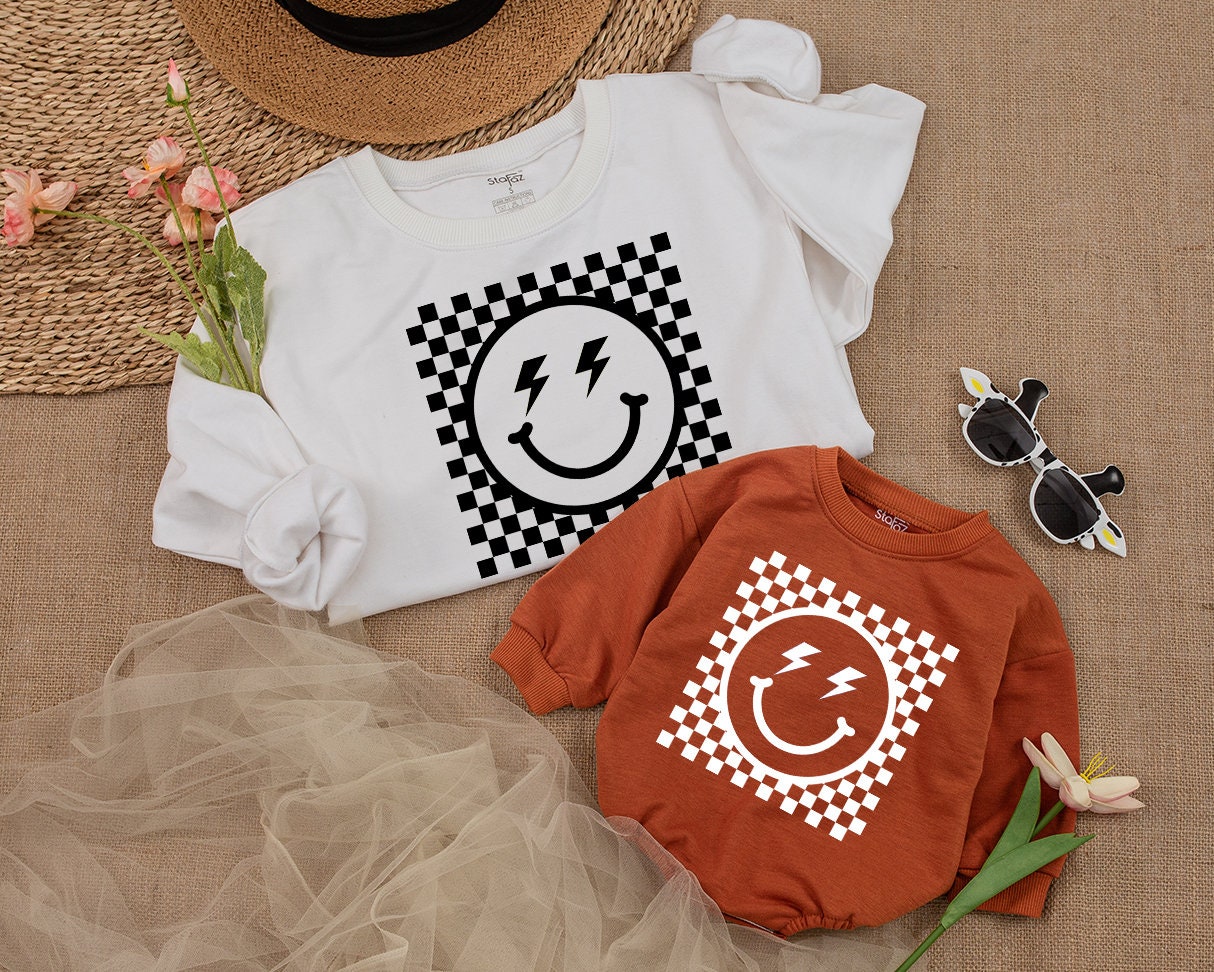 Bold Retro Checkered Smiley Face Kids Sweatshirt Vintage Happy Eye Design Playful Black and White Pattern Apparel Comfortable Toddler Youth Top