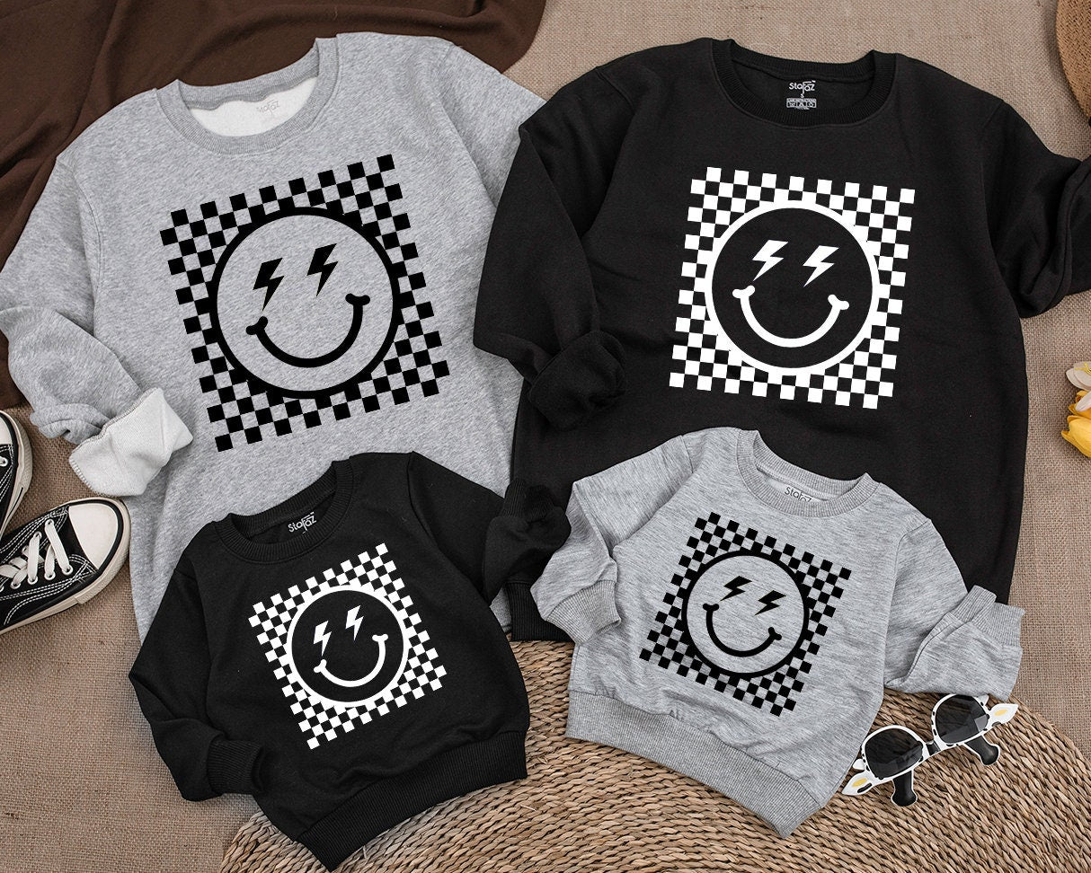 Bold Retro Checkered Smiley Face Kids Sweatshirt Vintage Happy Eye Design Playful Black and White Pattern Apparel Comfortable Toddler Youth Top