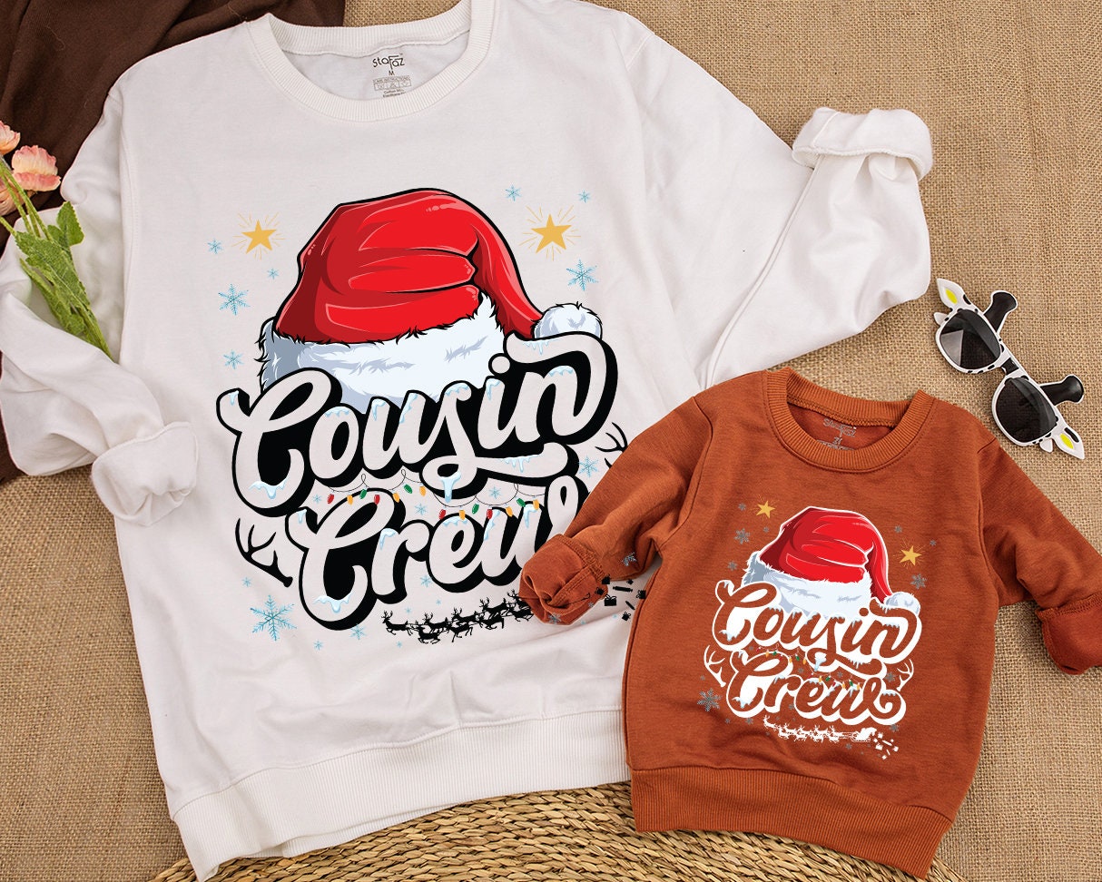 Cousin Crew Christmas Sweatshirt with Santa Hat and Lights, a festive family matching top for kids, baby, toddlers, and adults this holiday season.