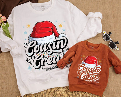 Cousin Crew Christmas Sweatshirt with Santa Hat and Lights, a festive family matching top for kids, baby, toddlers, and adults this holiday season.