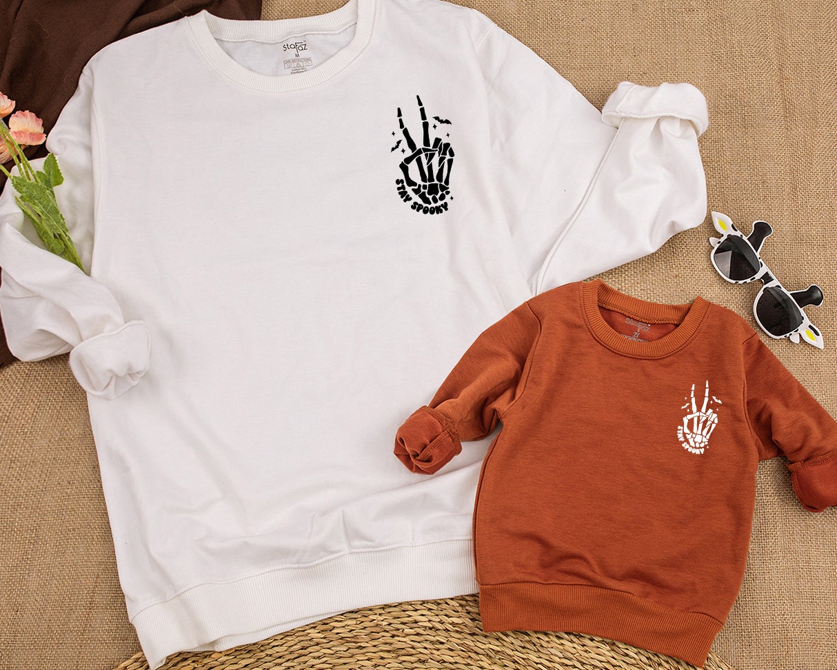 Stay Spooky Skeleton Hands Skull Halloween Sweatshirt perfect for Kids & Toddlers embracing Horror Party vibes with a cozy Fall Crewneck Shirt