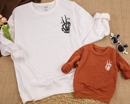 Stay Spooky Skeleton Hands Skull Halloween Sweatshirt perfect for Kids & Toddlers embracing Horror Party vibes with a cozy Fall Crewneck Shirt
