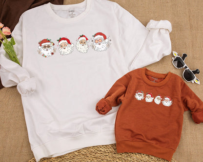 Retro Cheerful Santa Christmas Sweatshirt Vintage Whimsical Santa Heads Kids Toddler Baby Holiday Shirt with Retro Flowers