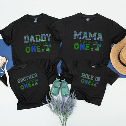 Hole in One First Birthday Matching Family Golf Theme Party Shirt Outfit with Daddy Mama Brother Plaid Green Blue Design and playful Golf Cart Blue Balloons perfect for an unforgettable celebration.