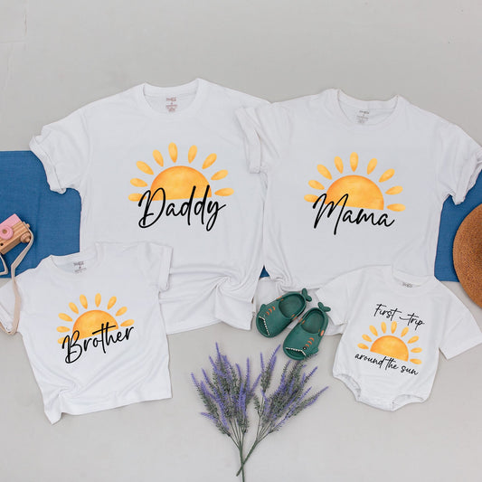 Custom First Trip Around The Sun Birthday Shirt with Cheerful Boho Sun Design for Matching Family First Birthday Outfits featuring bright orange and yellow rays