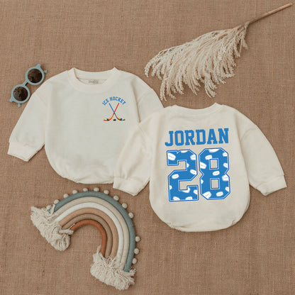 Personalized Baby Ice Hockey Bubble Romper with Name and Number 28, featuring Crossed Sticks and Puck Pattern, Future Player Newborn Gift for Little Fan