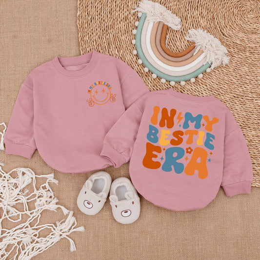 In My Bestie Era Baby Girl Romper, Playful Retro Smiling Face Design with Colorful Orange Blue Yellow Floral Stars, Oversized Sweater Gift