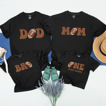 One Year Down Football First Birthday Matching Family Shirts with Brown Block Lettering Realistic Sports Game Day Theme Party Outfits