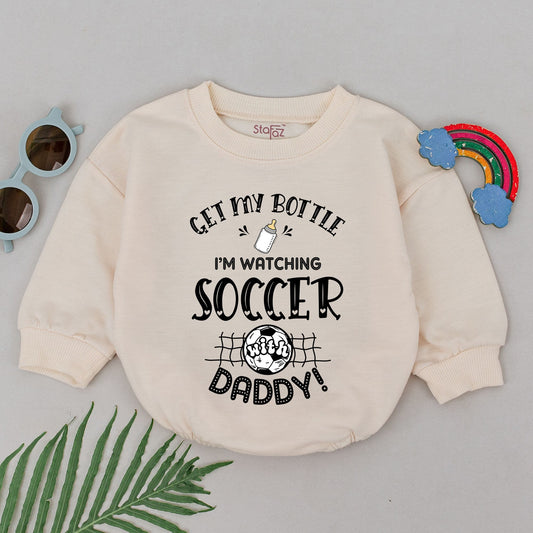 Get My Bottle I'm Watching Soccer With Daddy Baby Boy Romper adorable Father's Day Game Day outfit with whimsical black print baby bottle and soccer ball design