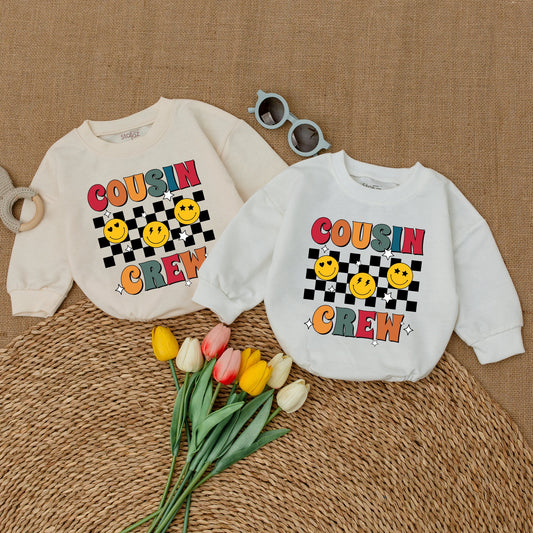 Cousin Crew Retro Smiley Face Baby Bodysuit Colorful Checkered Pattern Vintage Infant Romper Matching Family Reunion Outfit Playful Cool Cousins Club Announcement Clothes