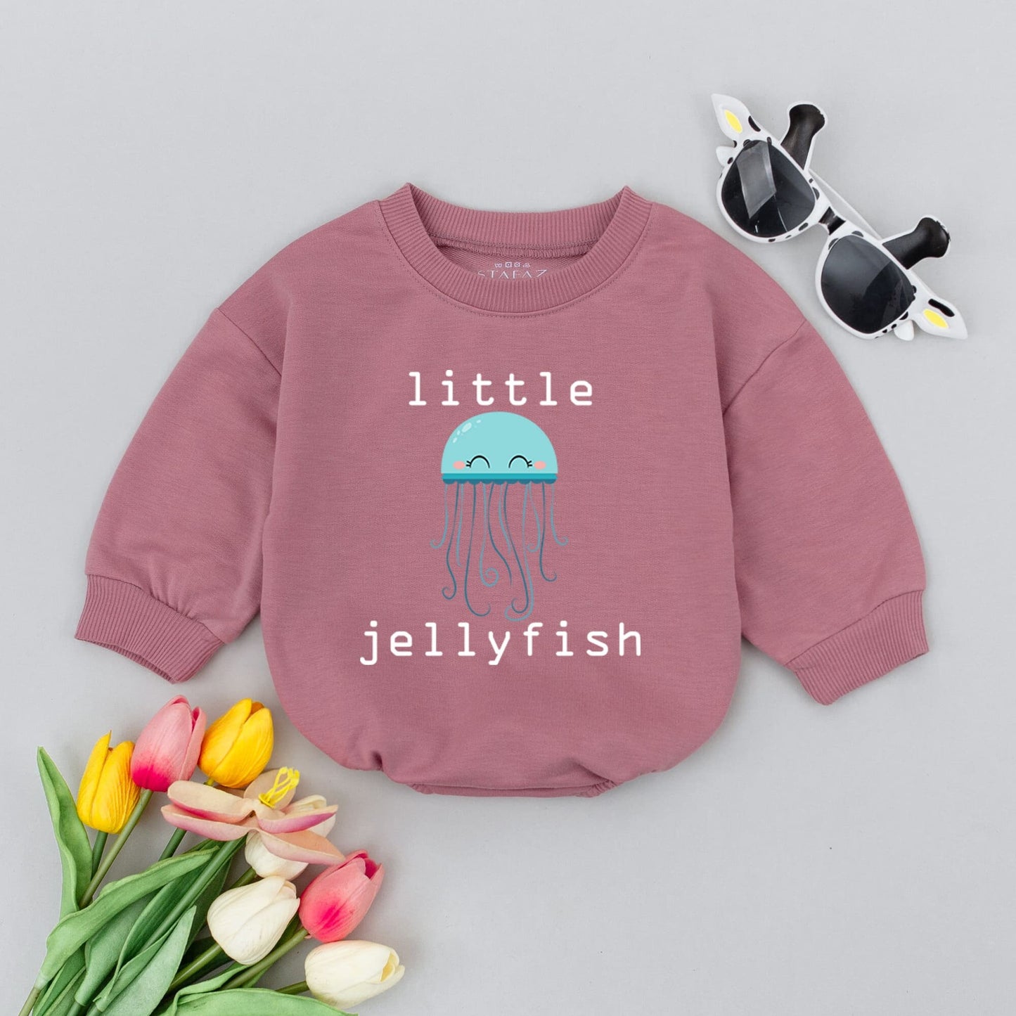 Little Jellyfish Baby Romper Unisex Minimalist Gender Neutral Infant Outfit featuring a cute light blue smiling jellyfish design perfect for baby showers.
