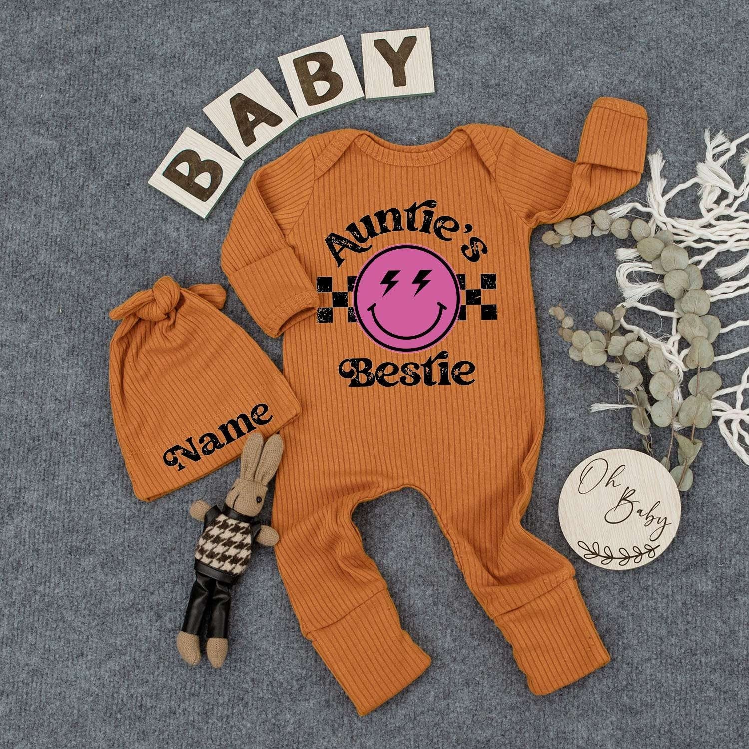 Auntie's Bestie Custom Newborn Girl Bodysuit & Hat Set with Pink Smiley Face Lightning Eyes Checkered Retro Cute Playful Baby Shower Gift Outfit
