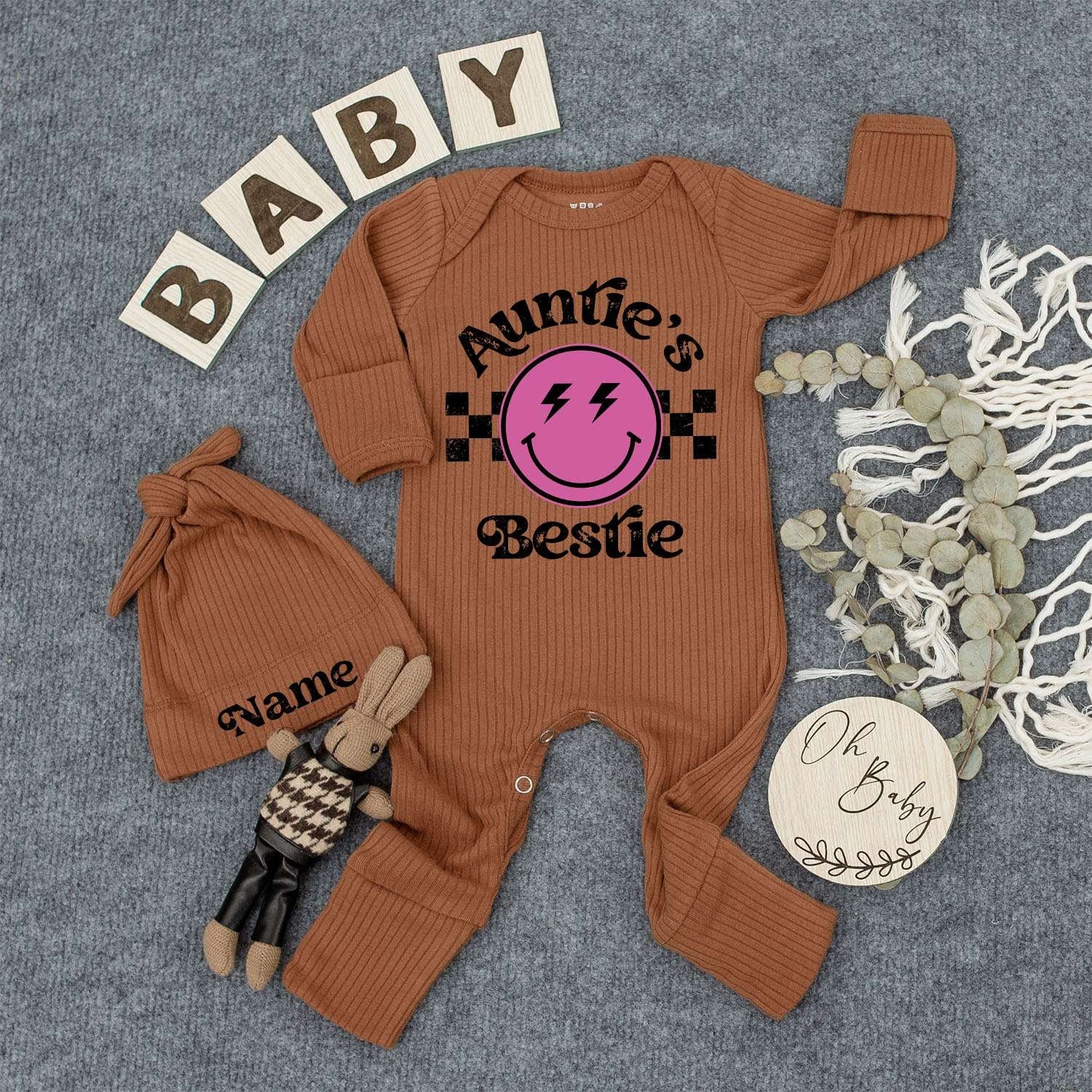 Auntie's Bestie Custom Newborn Girl Bodysuit & Hat Set with Pink Smiley Face Lightning Eyes Checkered Retro Cute Playful Baby Shower Gift Outfit