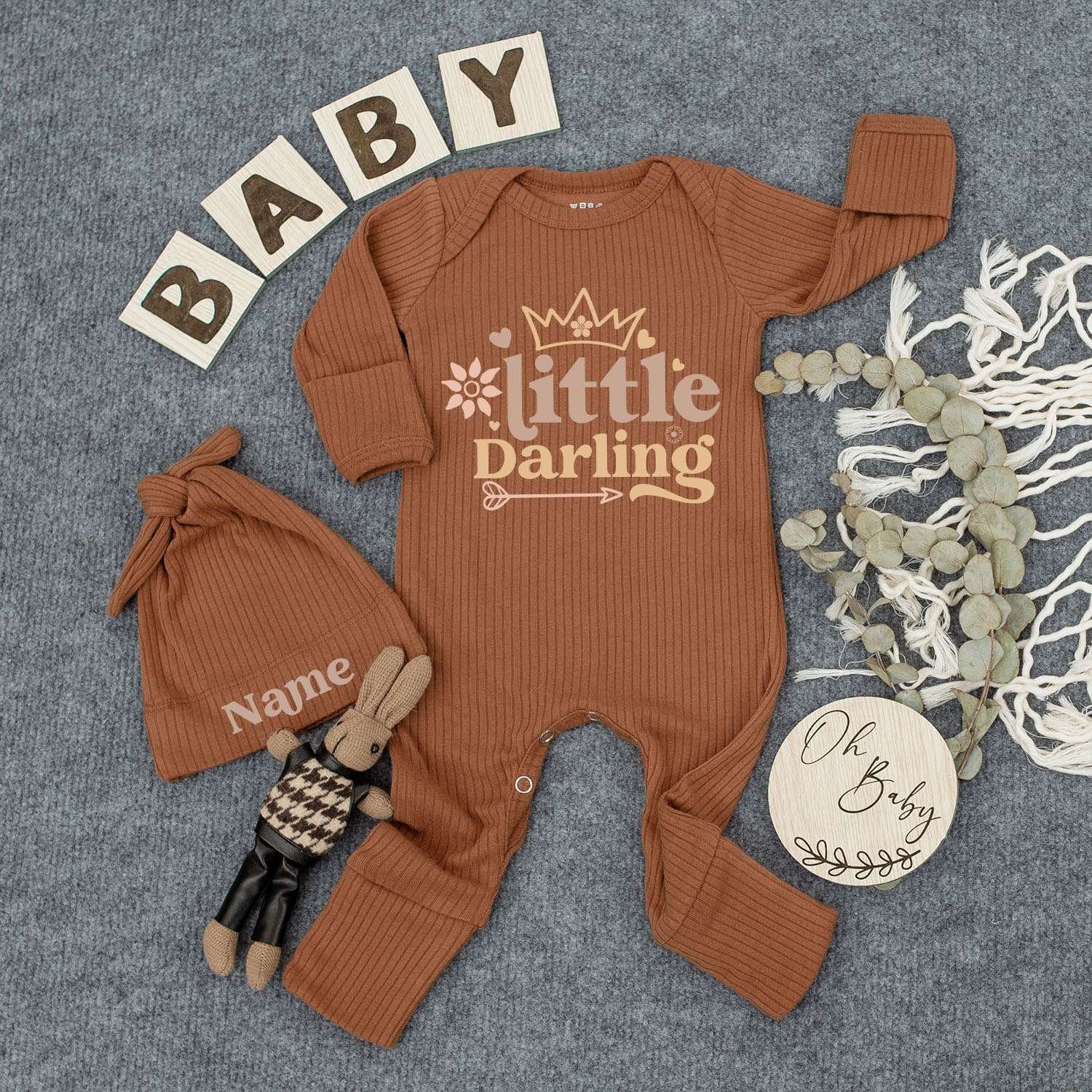 Personalized Little Darling Baby Bodysuit and Hat Set with Crown Flower Arrow Design Name on Hat Muted Orange Brown Colors Warm Inviting Newborn Outfit