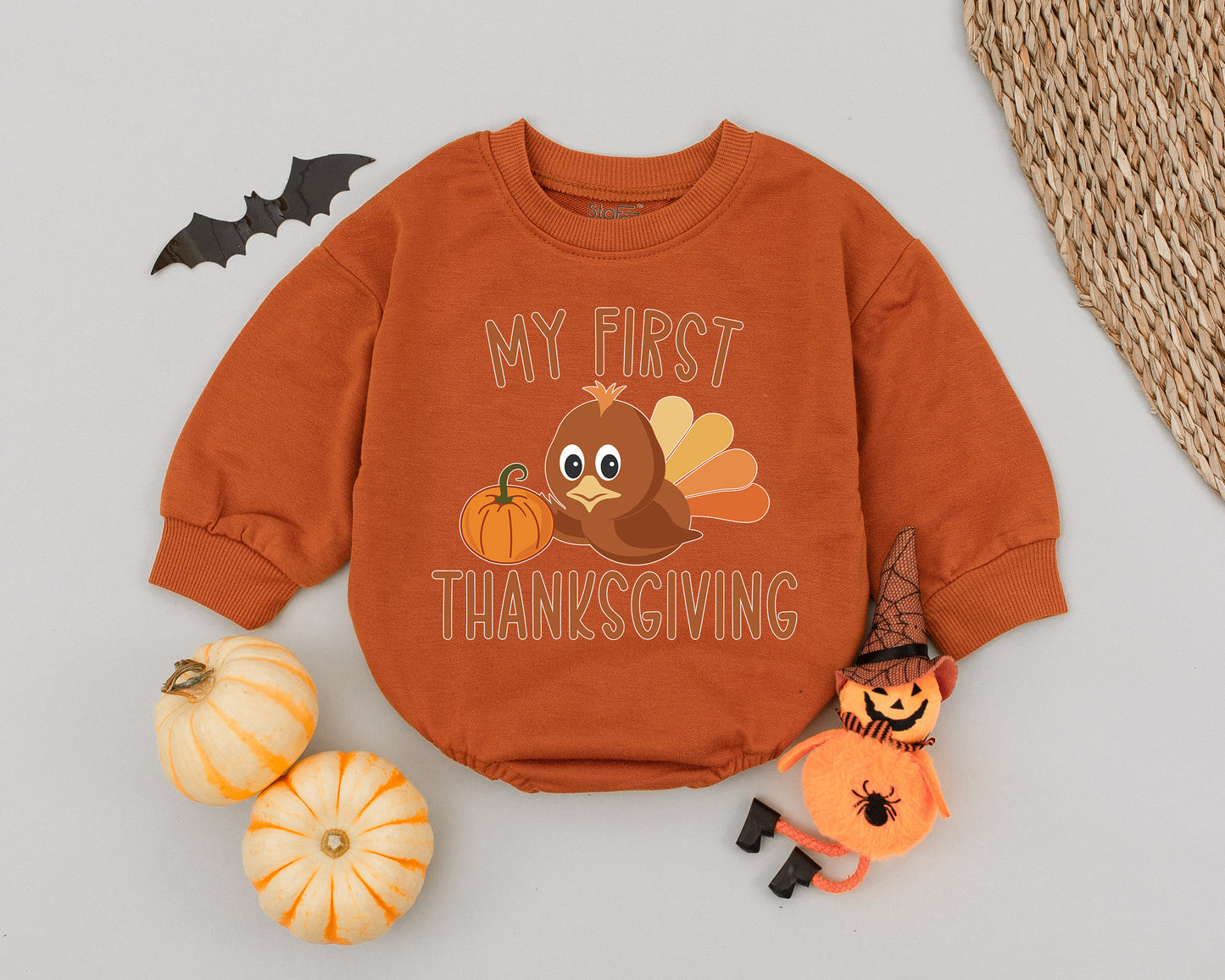 My First Thanksgiving Romper featuring a cute little turkey holding a pumpkin, perfect soft cotton baby bodysuit for autumn holiday photoshoots