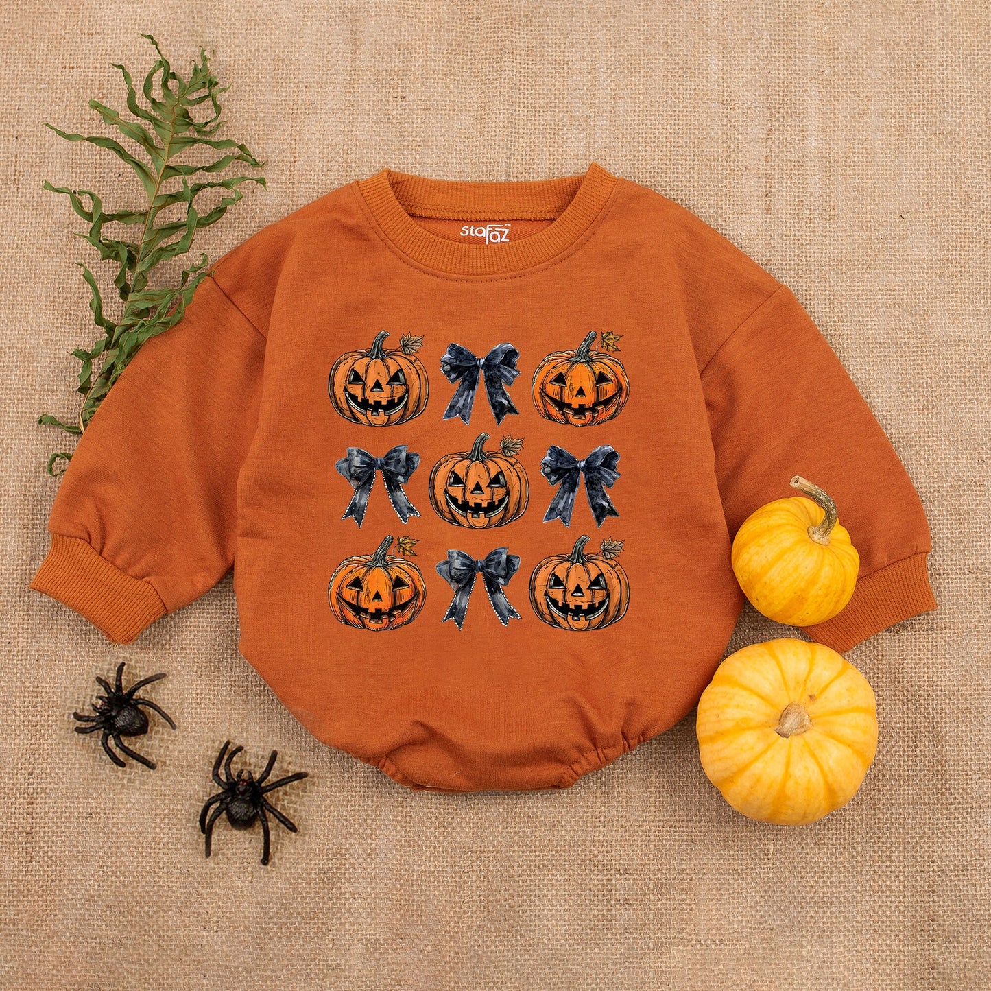 Adorable Retro Halloween Baby Romper featuring smiling jack-o'-lanterns and bows with autumn leaves a sweet first fall celebration outfit