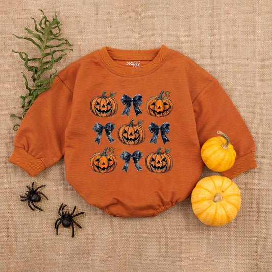 Adorable Retro Halloween Baby Romper featuring smiling jack-o'-lanterns and bows with autumn leaves a sweet first fall celebration outfit