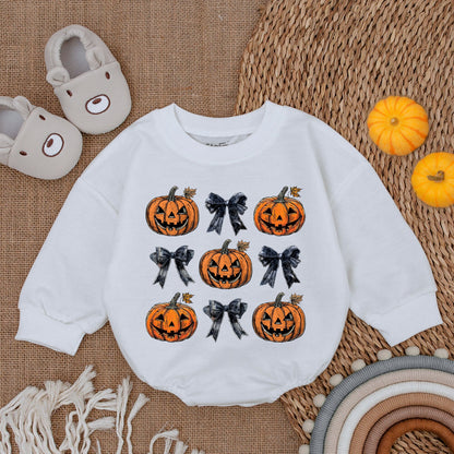 Adorable Retro Halloween Baby Romper featuring smiling jack-o'-lanterns and bows with autumn leaves a sweet first fall celebration outfit