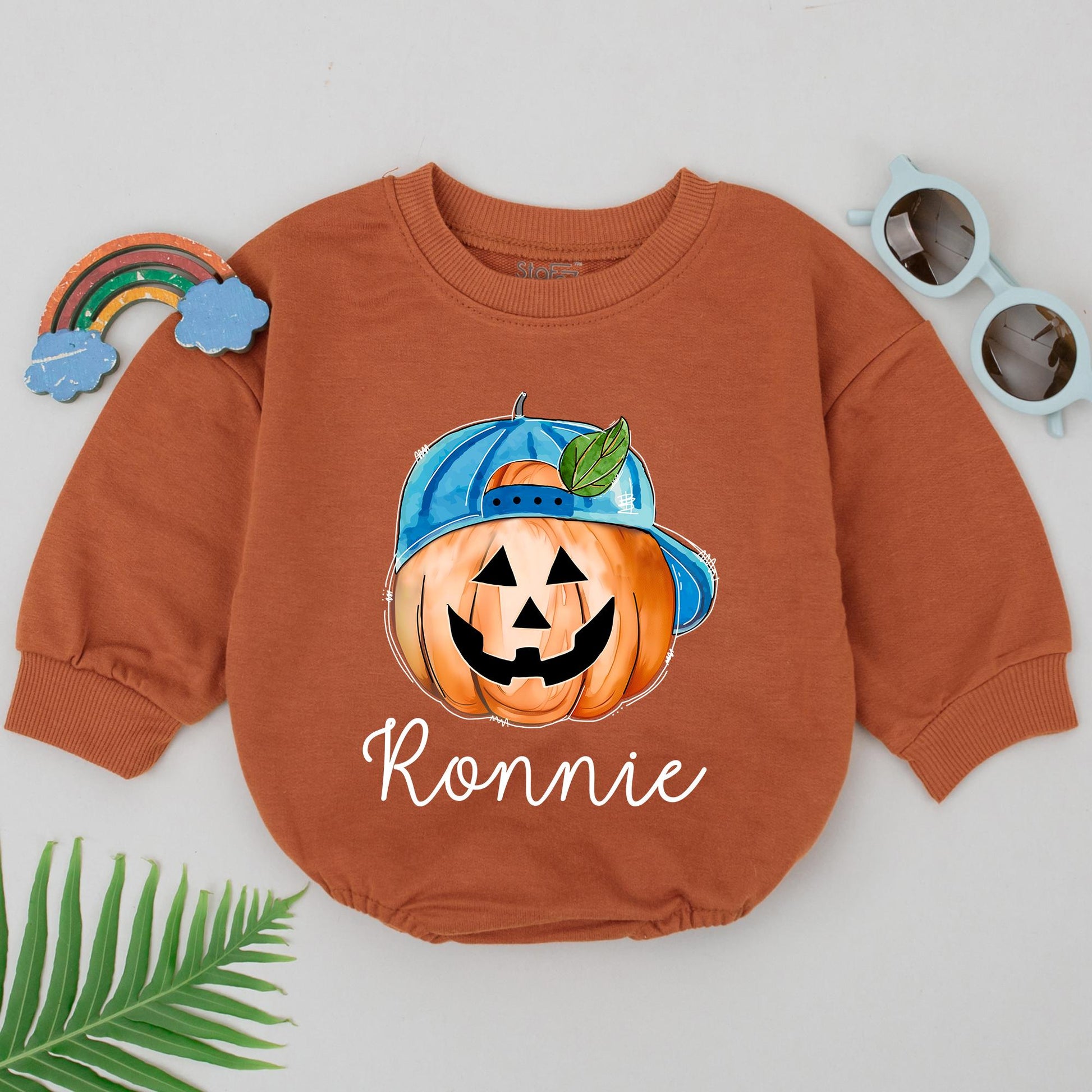 Personalized Ronnie's First Halloween Romper, Cute Pumpkin Baby Outfit with Blue Cap, Spooky Season Bodysuit, Baby Shower Gift, Newborn Boy Clothes (139 chars)