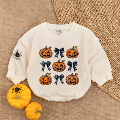 Adorable Retro Halloween Baby Romper featuring smiling jack-o'-lanterns and bows with autumn leaves a sweet first fall celebration outfit